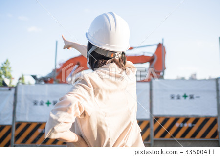 Female worker at construction site Female worker at construction site 33500411
