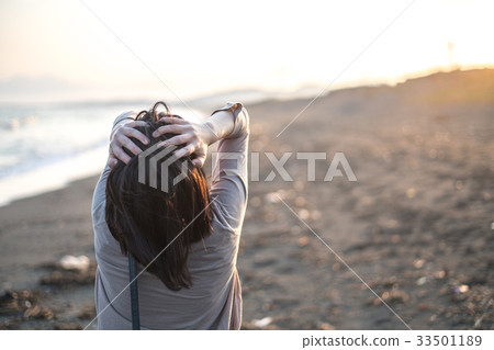 Woman at the beach Woman at the beach 33501189