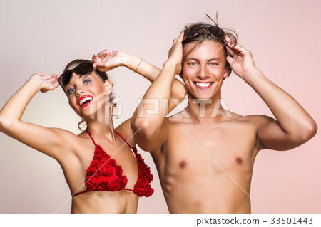 beautiful couple in bikini and shorts beautiful couple in bikini and shorts 33501443