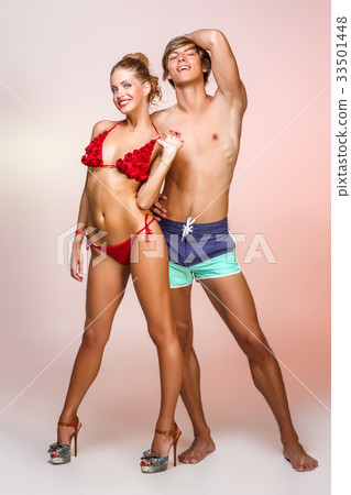 beautiful couple in bikini and shorts beautiful couple in bikini and shorts 33501448
