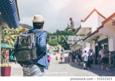 Young man traveler is visiting Tian Tan Buddha  33501925