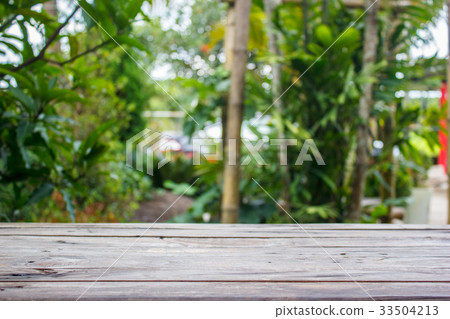 Wood table with nature background Wood table with nature background 33504213