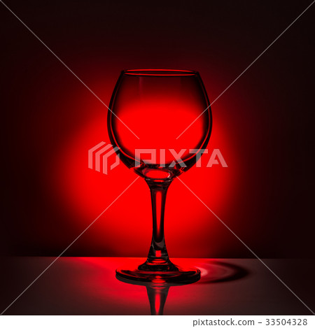 silhouette empty wine glass on red and black 33504328