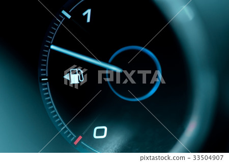 Close-up of the dashboard and fuel gauge 33504907