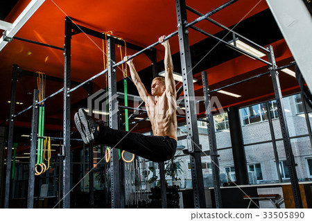 Bar exercises. workout in dark gym 33505890
