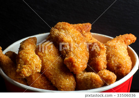 Bucket of chicken nagets. 33506036