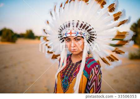 Young American Indian woman in traditional costume Young American Indian woman in traditional costume 33506353