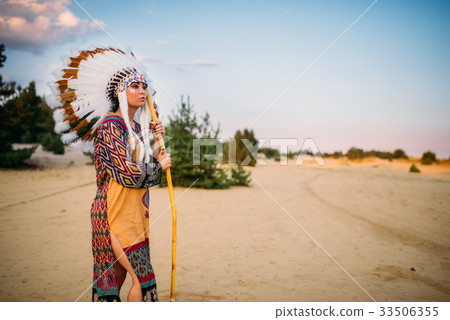 American Indian woman against mountain valley 33506355