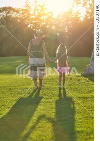 Girl with grandma back view. Girl with grandma back view. 33507140