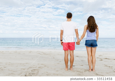 Young couple in love on the beach Young couple in love on the beach 33511458
