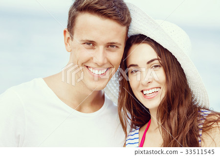 Romantic young couple on the beach Romantic young couple on the beach 33511545