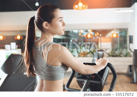 Woman training in gym body health fit care Woman training in gym body health fit care 33517072