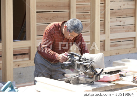 House and carpenter under construction House and carpenter under construction 33519864
