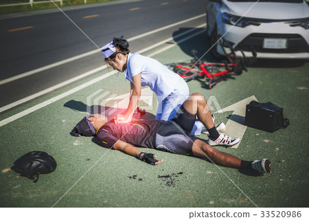 Female nurse helping Emergency CRP on bicycle man Female nurse helping Emergency CRP on bicycle man 33520986