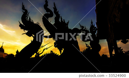 Silhouette dragon statue against twilight sky Silhouette dragon statue against twilight sky 33524900