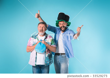 The two football fans over blue 33529273