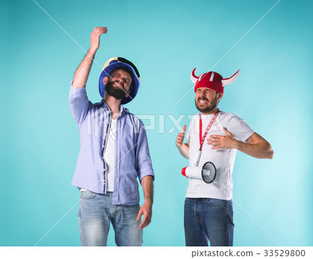 The two football fans over blue 33529800