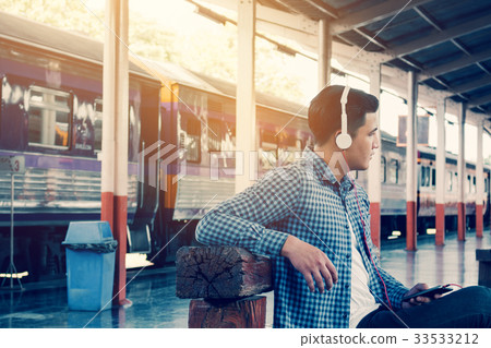 Handsome young asian man listen music smartphone 33533212