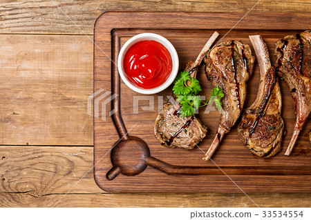 Roasted lamb ribs with sause Roasted lamb ribs with sause 33534554