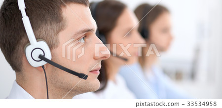 Call center operators. Focus at businessman in 33534958
