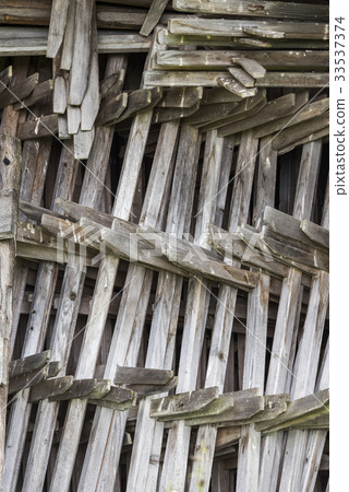 Pile of Hay Stakes in Barn 33537374