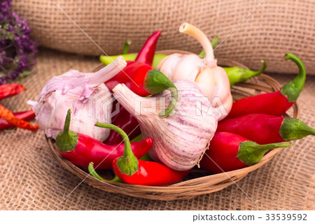 garlic, green and red hot chili peppers garlic, green and red hot chili peppers 33539592