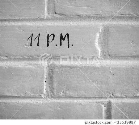 11 P.M. WRITTEN ON WHITE PLAIN BRICK WALL 33539997