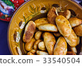 Latvian tradition baked meat pies in a large bowl 33540504