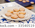 White plate with light biscuits with sugar pieces 33540519