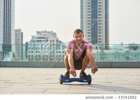Man on gyroscooter outdoors. 33541002