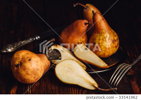 Few Golden Pears on Table. 33541962