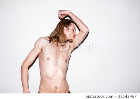 Adult man showing off his muscles Adult man showing off his muscles 33542467