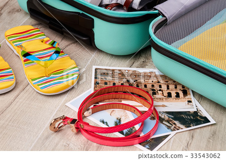 Attributes of summer rest, open suitcase. 33543062