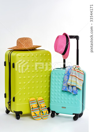 Colorful summer clothes and suitcases. Colorful summer clothes and suitcases. 33544171