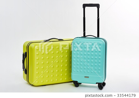 Close up of wheeled suitcases. 33544179
