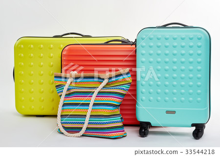 Suitcases on wheels, cotton handbag. 33544218