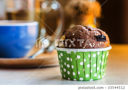 Close up  chocolate cupcake on table in cafe shop. 33544512