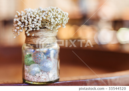 Dried flowers in glass bottle Dried flowers in glass bottle 33544520