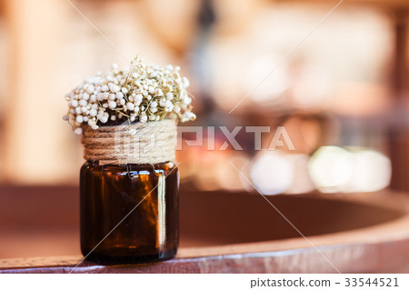 Dried flowers in glass bottle Dried flowers in glass bottle 33544521