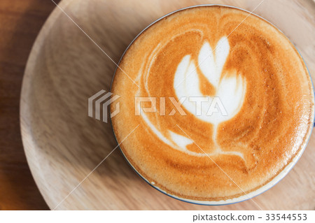 Top view of coffee cup on table. Top view of coffee cup on table. 33544553