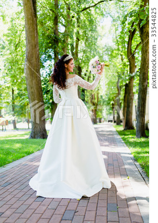 Portrait of very beautiful bride with the bouquet 33544825