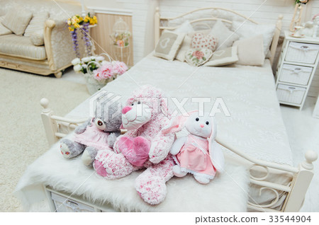 Bright and fresh bedroom decorated with a toys. Bright and fresh bedroom decorated with a toys. 33544904