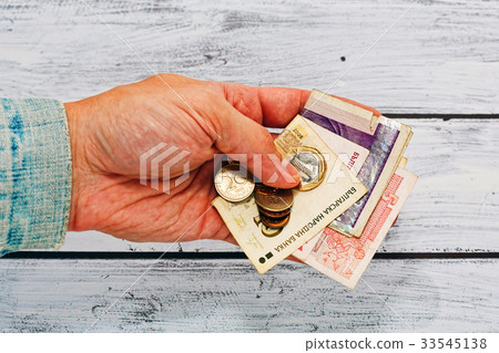 Male hand in old jacket holding money of Bulgaria Male hand in old jacket holding money of Bulgaria 33545138