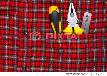 Work tools in work shirt pocket Work tools in work shirt pocket 33545148