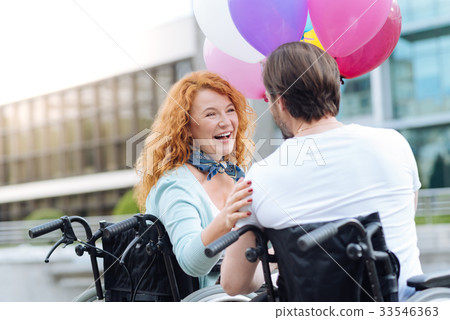 Positive senior woman resting with her 33546363