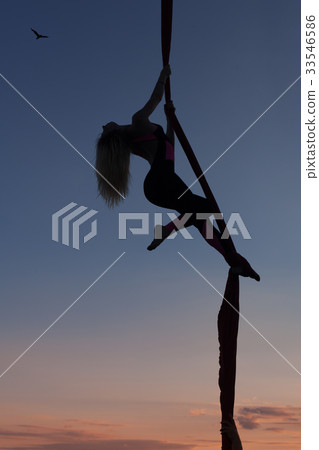Woman acrobat dances on on canvases. Woman acrobat dances on on canvases. 33546586