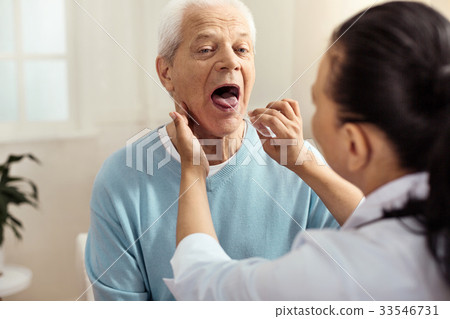 Nice professional nurse holding a plastic stick Nice professional nurse holding a plastic stick 33546731