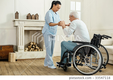 Professional experienced caregiver looking after Professional experienced caregiver looking after 33547118