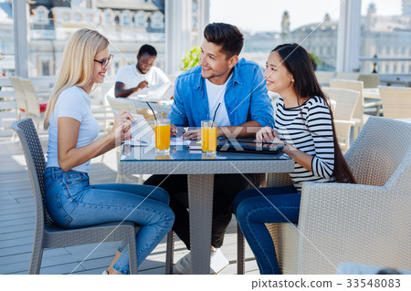 Side view on female student sharing news 33548083