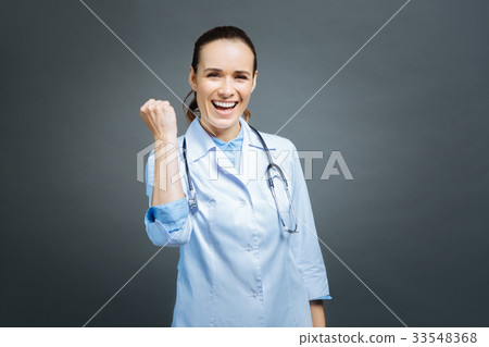 Excited female doctor getting excited into camera 33548368